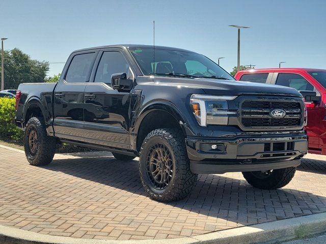 2026 Ford F-150 Lariat in Black Metallic — front three-quarter view