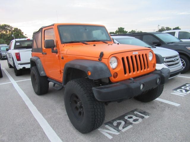 2013 Jeep Wrangler Sport in Crush — front three-quarter view